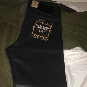 Naked and famous black wax denim jeans